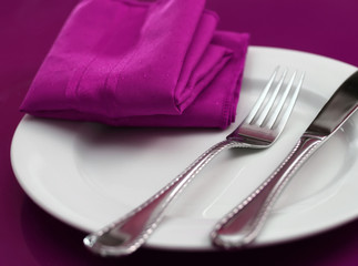 A bright and colorful table setting in pink