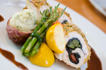 Breaded chicken slices stuffed with sweet peppers