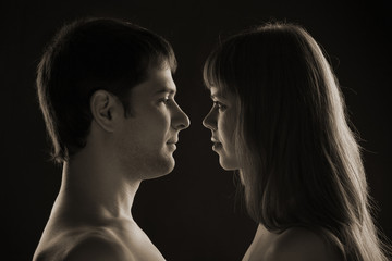 A photo of man and woman, isolated on black, toned