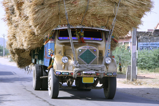 Premium AI Image  Overloaded truck with goods jutting out