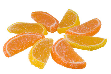 Bicoloured sweets in the form orange fruit candy laid out
