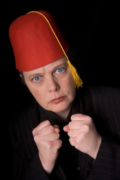 Woman Wearing A Red Shriners Fez Over A Black Background