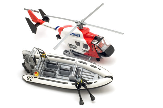 object on white - toy model motor boat and helicopter