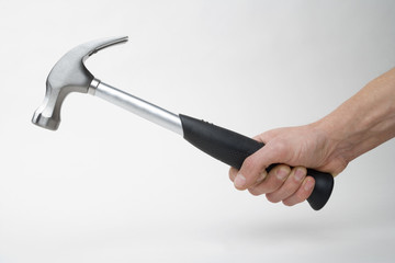 holding a clawhammer