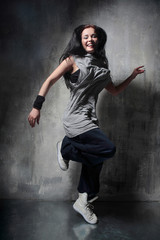 the dancer posing on dark grey background