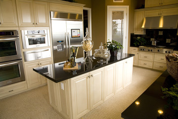 Luxury home kitchen with a granite island.