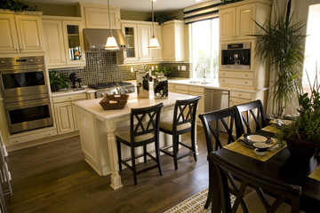 Spacious kitchen with table and island.