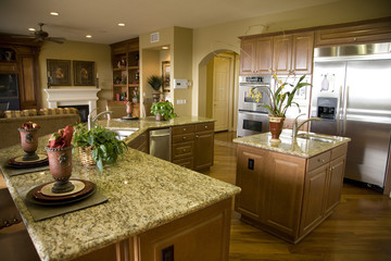 Luxury home kitchen with a granite top island. 