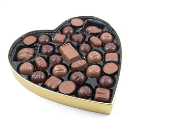 A large box of chocolate Valentines candy.