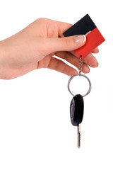 Hand holding car key