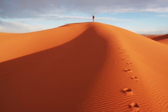Man observer  sand desert