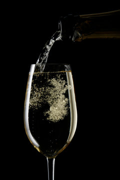 champagne splash on flute glass