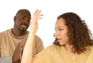 Man begging for forgiveness in an argument with his girlfriend