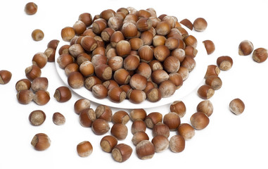 nuts in plate over white background