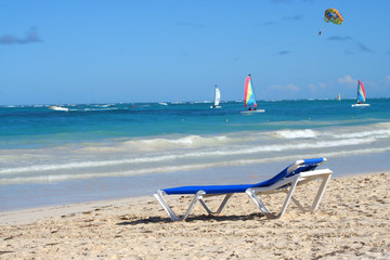 empty beach chair overlooking the ocean 