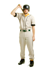 A young male baseball player standing.