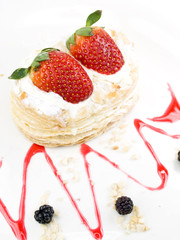 Cake of strawberries with cream and puff-pastry