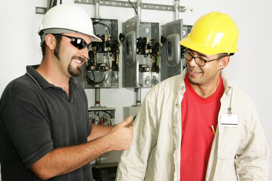 Electrical foreman giving a worker the thumbs-up. 