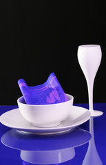 A modern table setting with plate and wine glass 