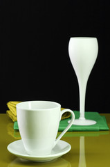 Fototapeta premium Modern style table setting with coffee cup and wine glass