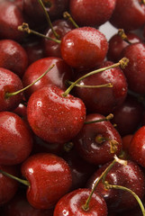 red cherries with water drops texture close up