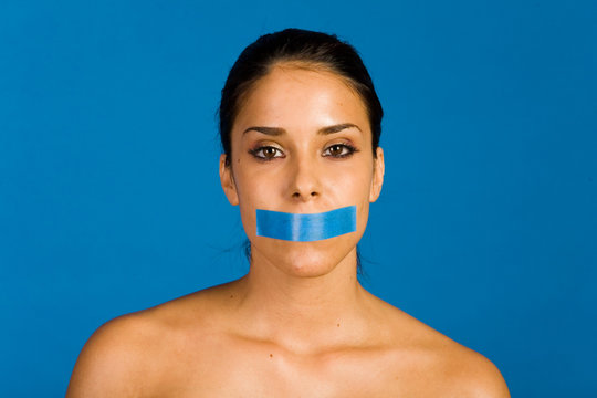 Woman With A Duct Tape Over Her Mouth