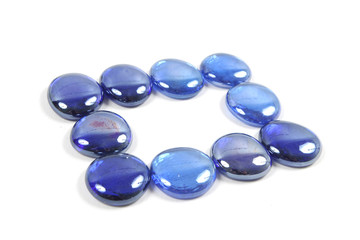 Blue glass stones isolated on a white background.