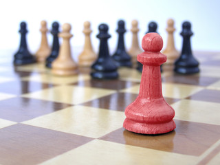 team of pawns with red leader