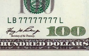 One hundred dollar bill with lucky number