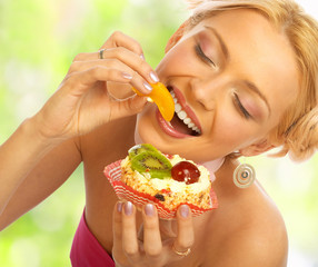 Pretty  woman eating the cake..