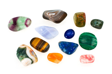 Multi-coloured ornamental stones on a white background