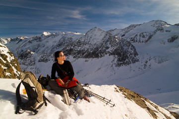 Girl relaxing in winter mountains