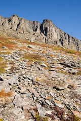 A norwegian mountain detail with a rock in the foreground