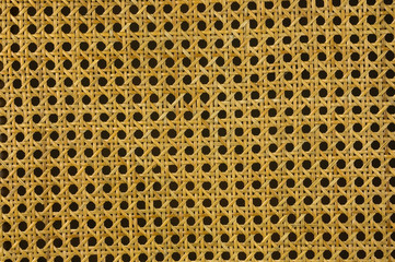 Yellow pattern detail of a wicker chair