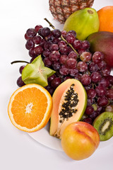 Naklejka na ściany i meble Healthy fruit assortment with papaya, kiwi, orange and grapes