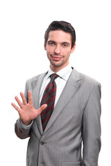 businessman in a suit shows a palm on a white background