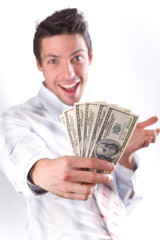 man smiles and stretches money