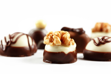 Chocolate candies on white 