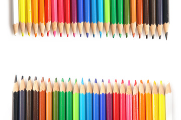 many colors of pencils situated on a both sides