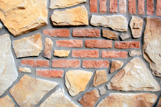 Background image of multi-colored stone and brick wall.