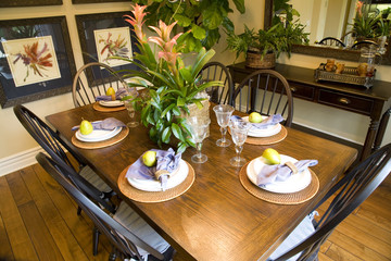 Festive dining table with luxurious dinnerware and decor.
