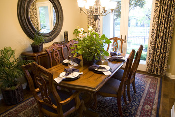 Festive dining table with luxurious dinnerware and decor.