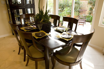 Dining room and table with luxurious decor.