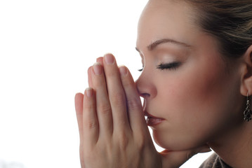 a woman is praying to god with hope