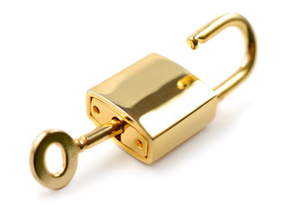 Golden padlock with key isolated over white background