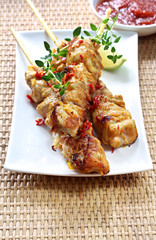 Chili chicken skewers served with a chili dipping sauce