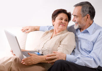 Senior couple on laptop. Concept may be is shopping in internet