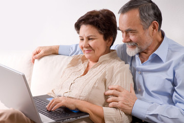 Senior couple on laptop. Concept may be is shopping in internet