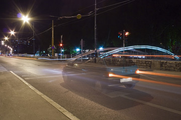 A car holds on a city traffic light