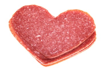 the heap of salami hearts isolated on white